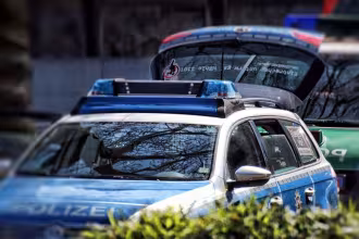 Police vehicle with flashing blue lights on the street